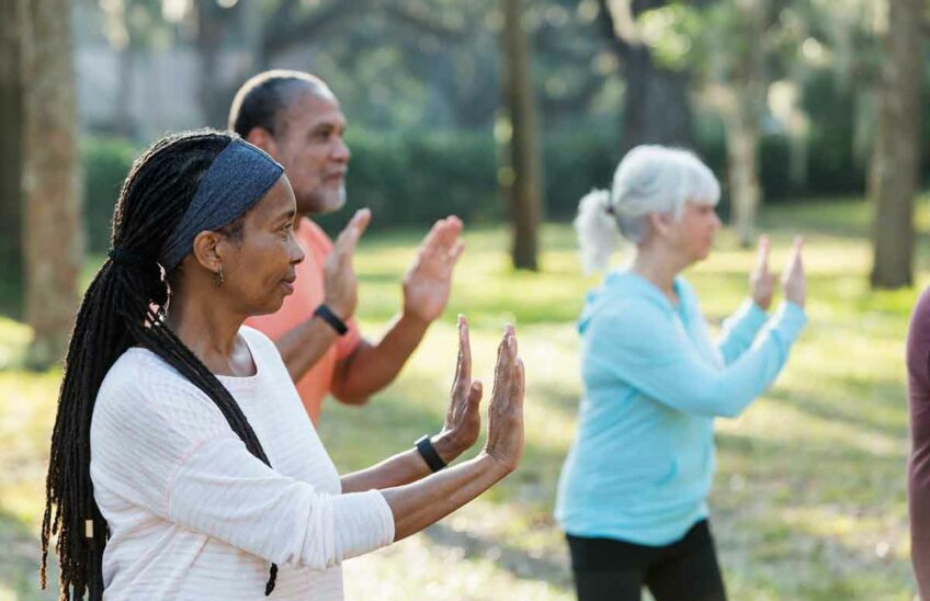 An outdoor group tai chi class